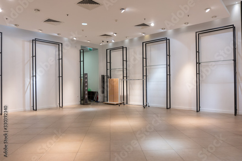 liquidation of goods and store. empty shelves and racks, no one