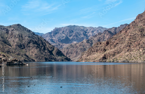 The mighty Colorado River at Willow Beach in Lake Mead National Recreation Area. Arizona is on left side of river and Nevada on the right.  photo