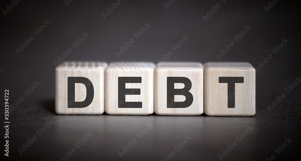 Obraz premium DEBT - financial business concept on a dark background
