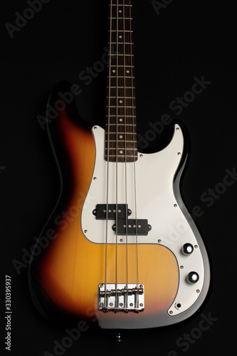 Bass guitar isolated on a black background