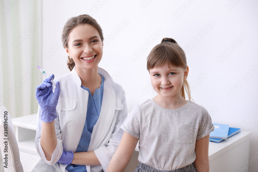 Little girl receiving chickenpox vaccination in clinic. Varicella virus prevention Little girl receiving chickenpox vaccination in clinic. Varicella virus prevention