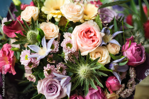 Colorful wedding bouquet on a restaurant served table. Bridal bouquet. Luxury royal restaurant. Valentine s day  birthday  dating or mother s day decoration