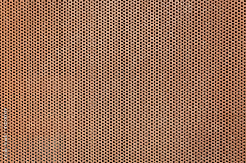 texture of a brown perforated metal plate background photo