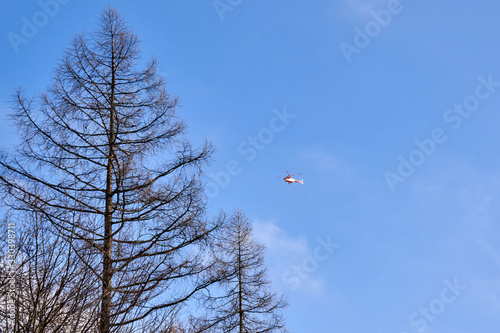 A rescue helicopter is coming back from The Tatras to Zakopane, Poland.