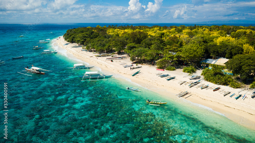 Aerial view of an awesome tropical beach in the Philipines. Honeymoon travel destination in the southeast