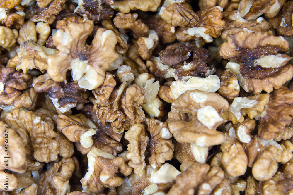 Unshelled walnuts. Background of fresh walnuts. Unshelled walnuts. Background of fresh walnuts.