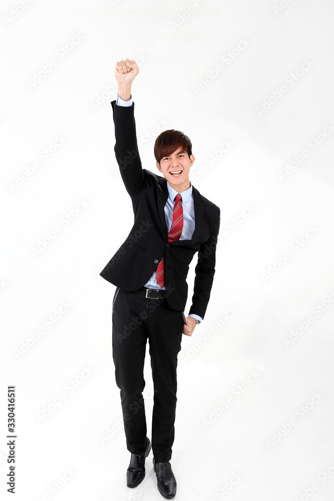 Young smart handsome Asian man business office wearing suit tie on white background look at camera walk forward fist up joy success Young smart handsome Asian man business office wearing suit tie on white background look at camera walk forward fist up joy success