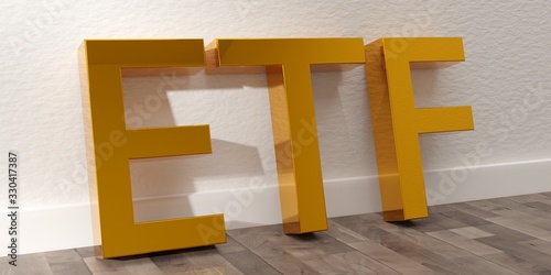 ETF - exchange traded funds - acronym in golden letters leaning against white wall on brown wooden floor background