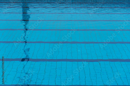 bright blue swimming pool lane in summer season relaxation background