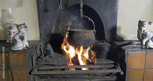 Sticks Blocks firewood and Peat Turf burning in open fire from a Bog in Ireland