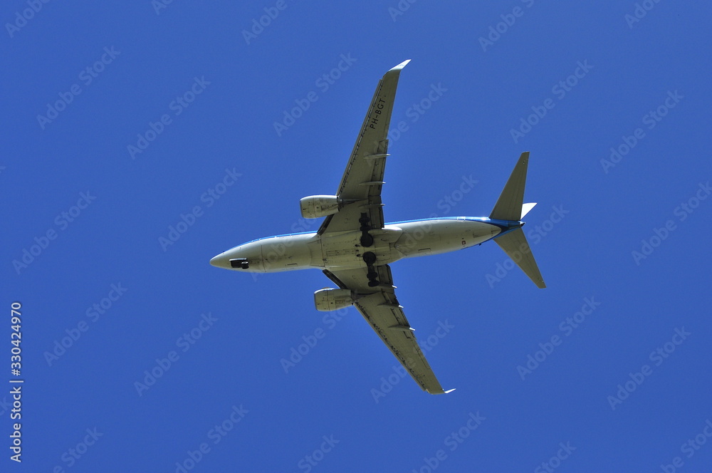 Landing the plane on a background of blue sky Landing the plane on a background of blue sky
