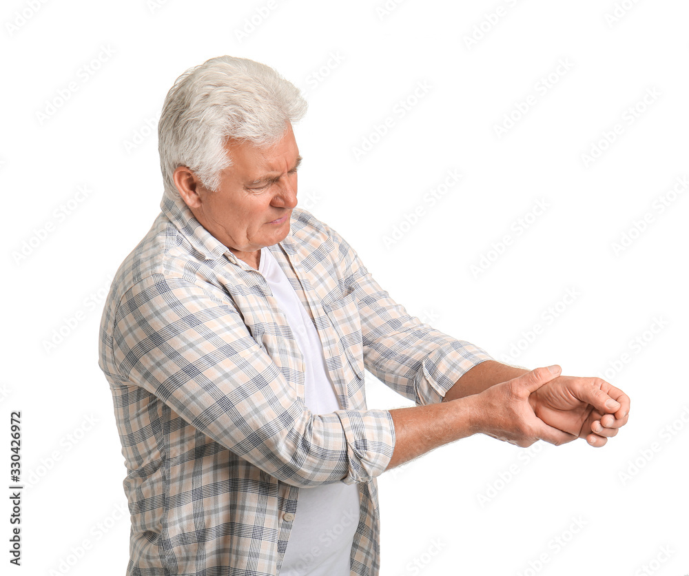 Senior man suffering from Parkinson syndrome on white background Senior man suffering from Parkinson syndrome on white background