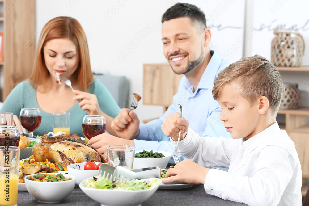 Family celebrating Thanksgiving Day at home