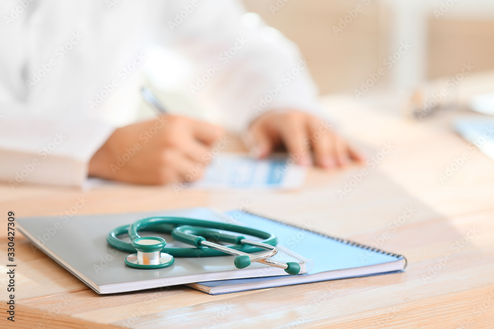 Stethoscope on table in doctor's office Stethoscope on table in doctor's office