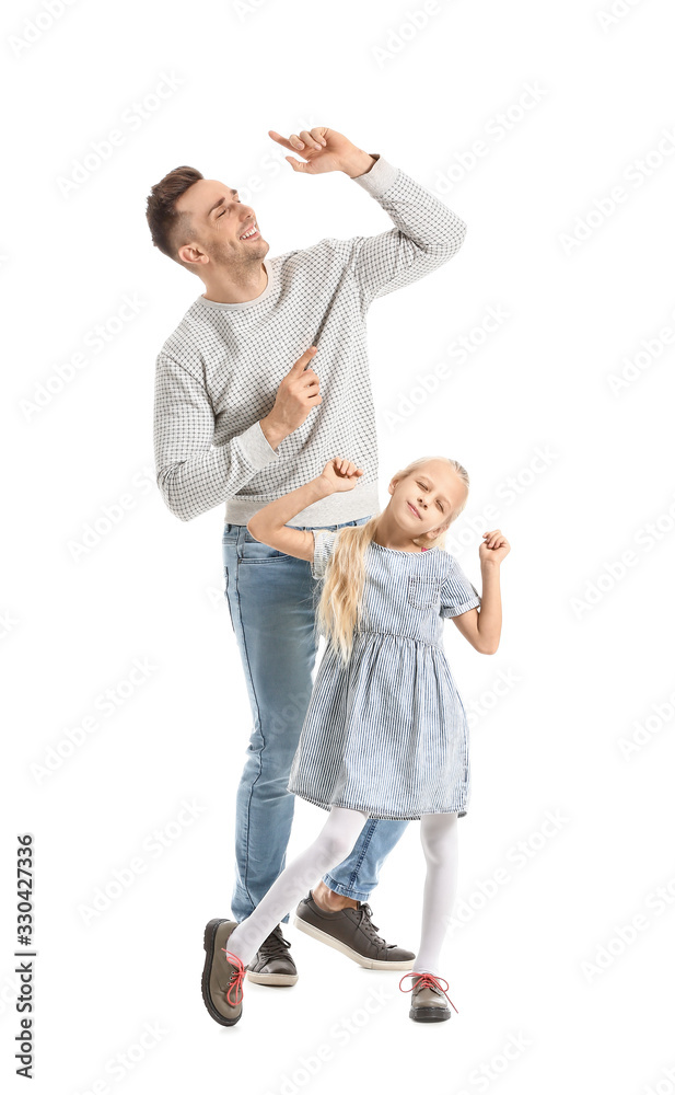 Man and his little daughter dancing against white background Man and his little daughter dancing against white background