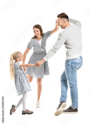 Happy family dancing against white background