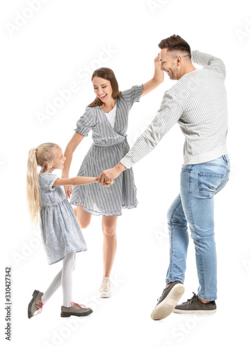 Happy family dancing agains...