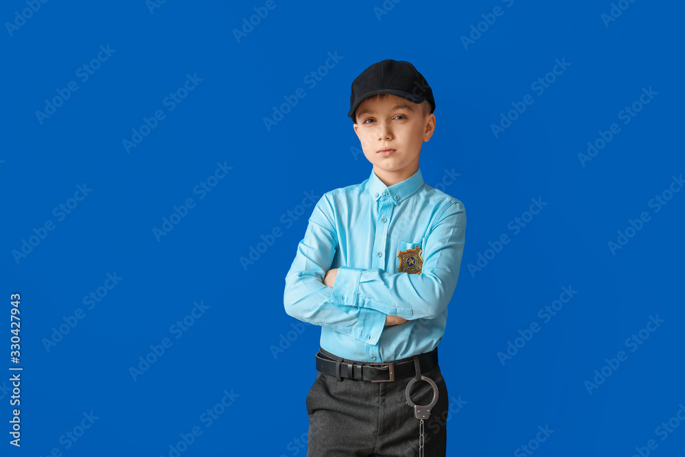 Cute little police officer on color background Cute little police officer on color background