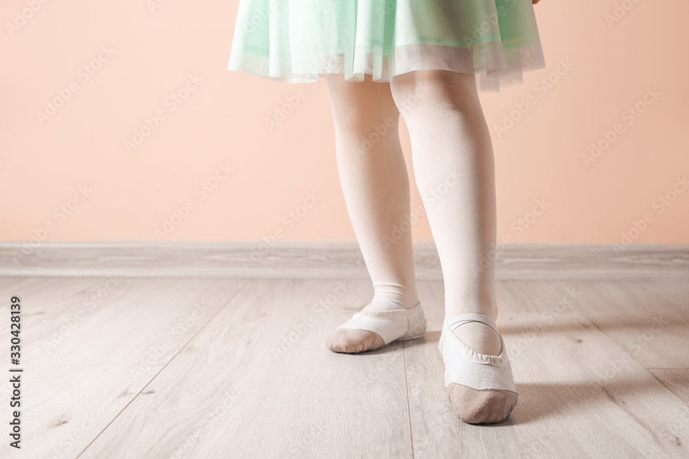 Legs of cute little ballerina near color wall Legs of cute little ballerina near color wall