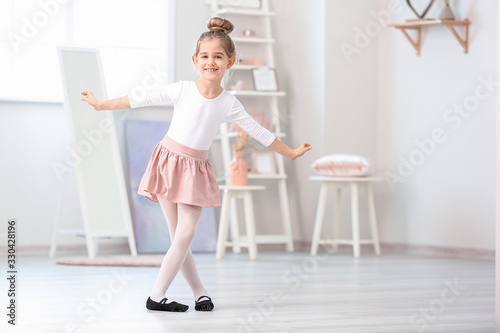 Cute little ballerina at home