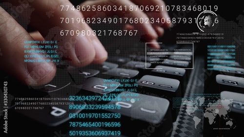 Man working on laptop computer keyboard with graphic user interface GUI hologram showing concepts of big data science technology, digital network connection and computer programming algorithm. photo