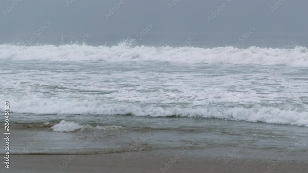 Slider shot following the curl of a large wave breaking in the Pacific Ocean Slider shot following the curl of a large wave breaking in the Pacific Ocean