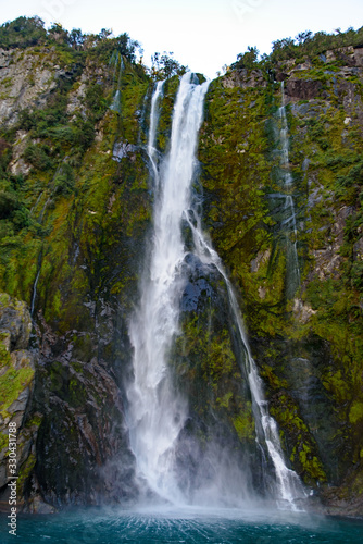 A waterfall at Milford Sound, Fiordland National Park, New Zealand © momo11353