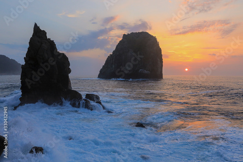 Beautiful sunset view on the rocky coast of the East Sea beach