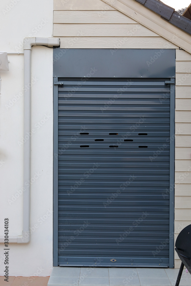 black roller shutter door closed security in house black roller shutter door closed security in house