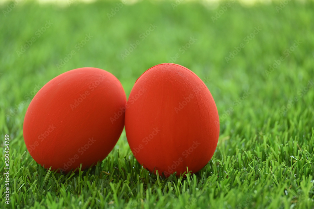 red easter egg on lawn green grass artificial, image of morning springtime concept