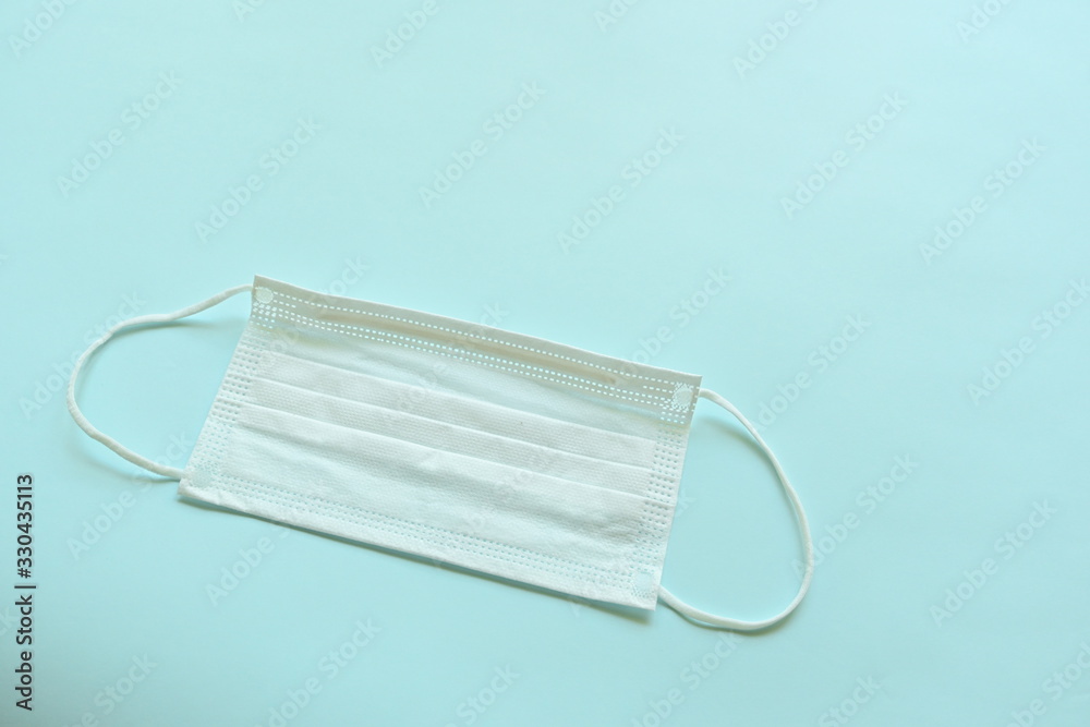 medical hygiene face mask on blue background medical hygiene face mask on blue background