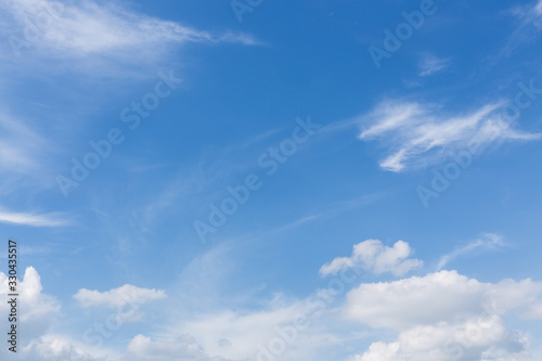 Fototapeta Naklejka Na Ścianę i Meble -  fluffy white cloud moving above clear blue sky
