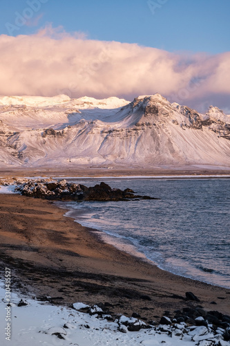 cold clear winter morning on dawn panoramic view of beach in Atlantic ocean in Iceland