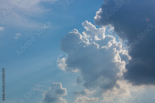 sun light shine through cloud on clear blue sky background © sutichak