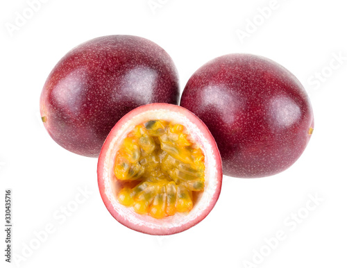 Purple passion fruit with cut in half isolated on white background.