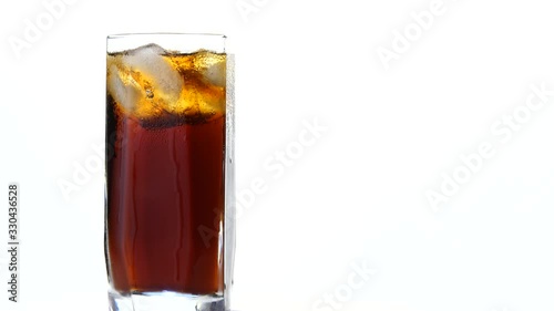 Wallpaper Mural Cola with ice in a swirling glass on a light background. Torontodigital.ca