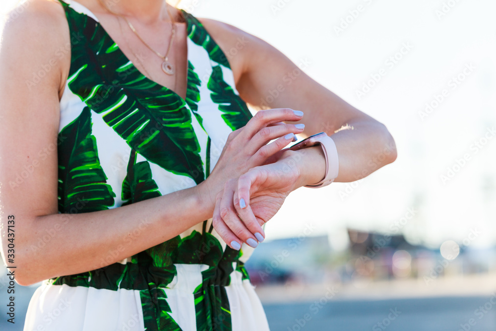 Female touching her smartwatch