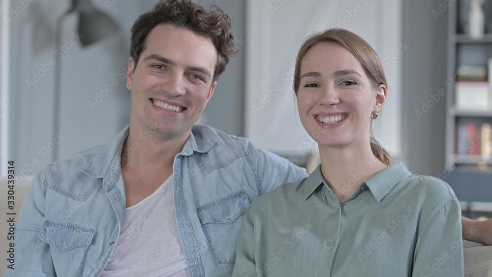 The Portrait of Happy Couple Smiling and Looking at the Camera The Portrait of Happy Couple Smiling and Looking at the Camera