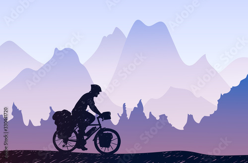 Man riding touring bicycle with bags with mountains background. Bikepacking in countryside