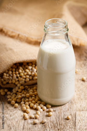 soy beans in gunny bag and soy milk in glass bottle
