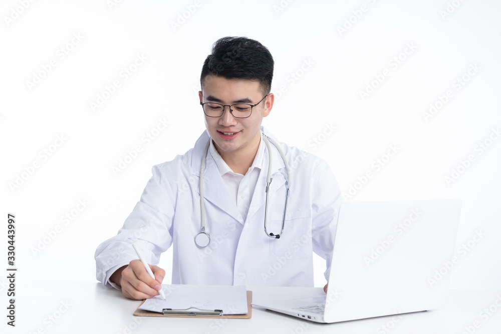A young Asian doctor is using a device A young Asian doctor is using a device