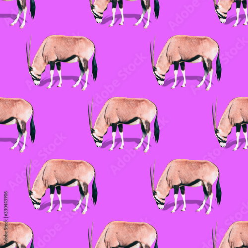A lot of wildebeests are on a bright purple background. A minimalistic collage art. Seamless pattern.
