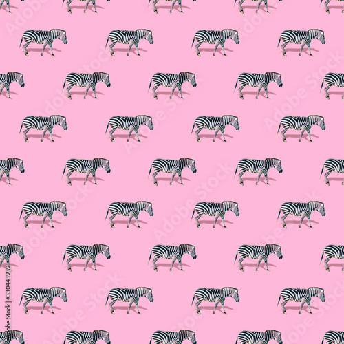 Many zebras are on soft pink background. Strong shadows. Minimalistic collage art. Seamless pattern. © Katya Havok