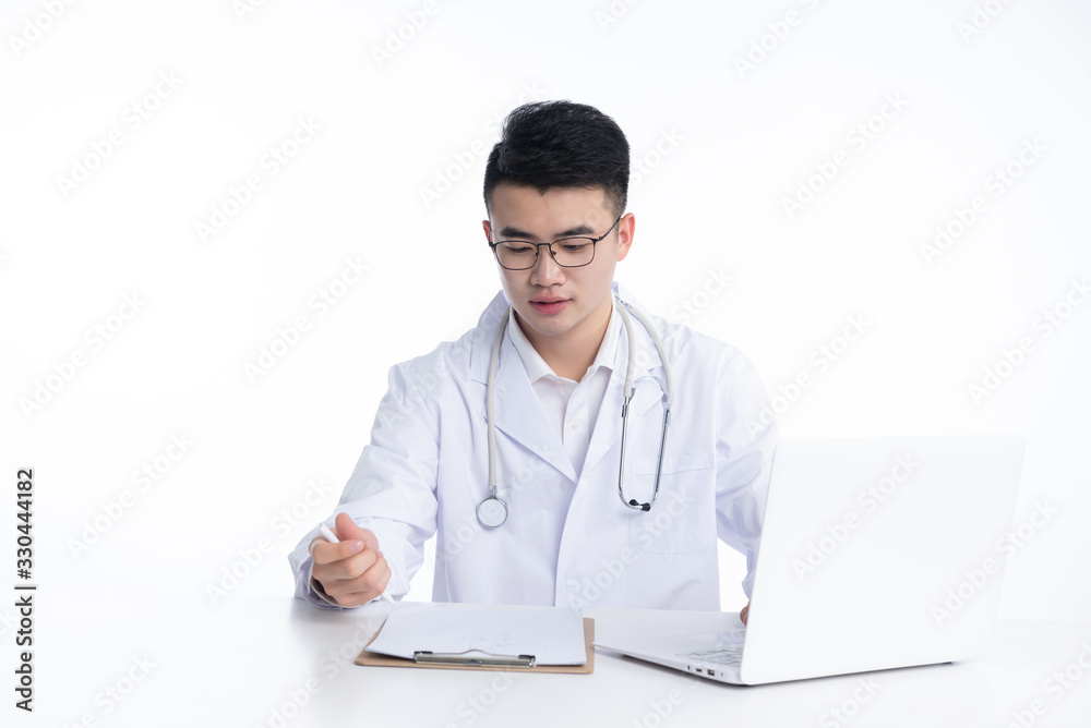 A young Asian doctor is using a device A young Asian doctor is using a device