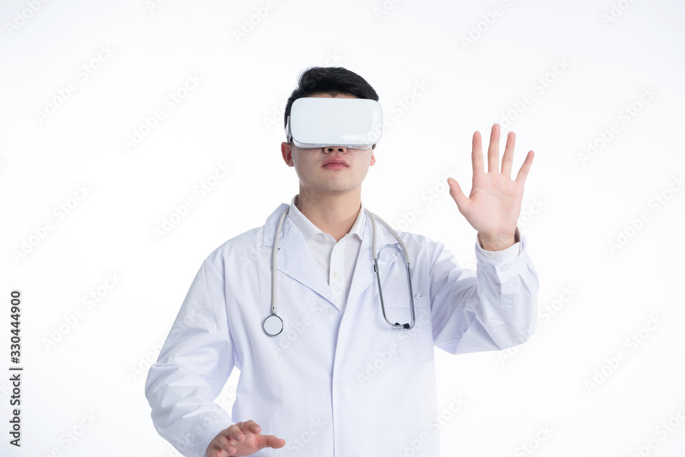 A young Asian doctor is using a device A young Asian doctor is using a device