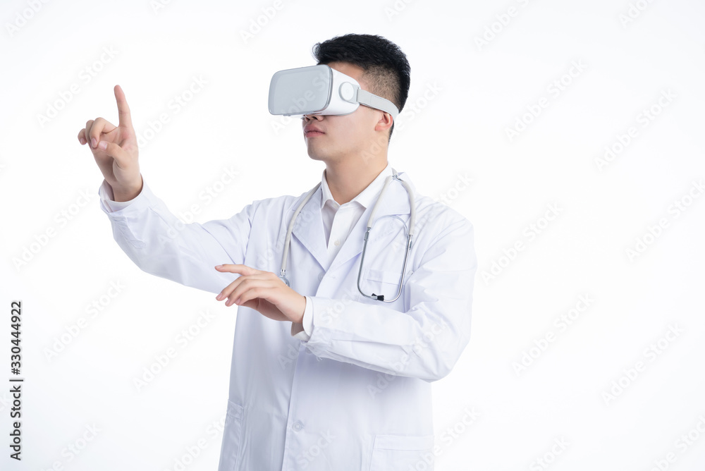 A young Asian doctor is using a device A young Asian doctor is using a device