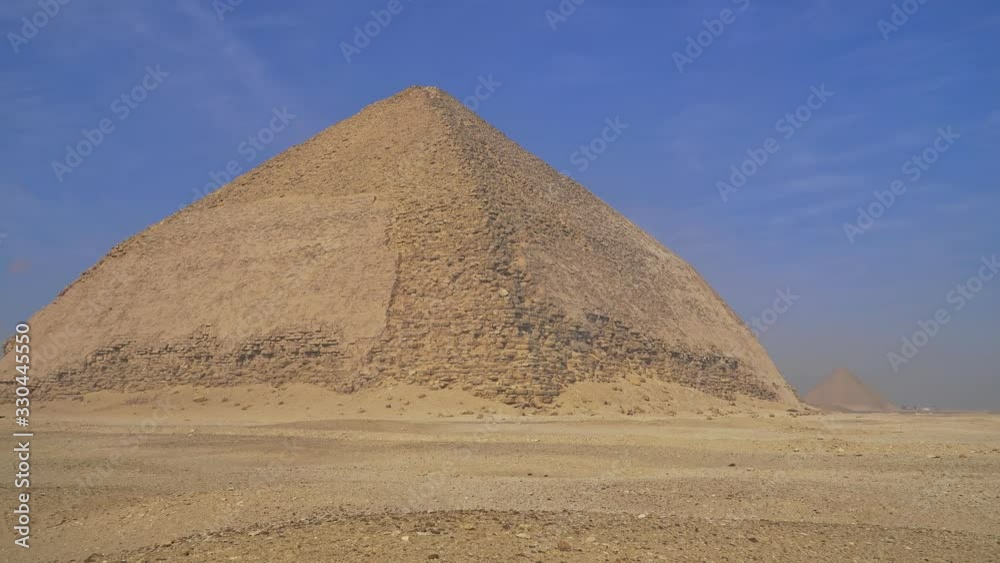 The Bent Pyramid is an ancient Egyptian pyramid located at the royal necropolis of Dahshur, approximately 40 kilometres south of Cairo, built under the Old Kingdom Pharaoh Sneferu. Egypt The Bent Pyramid is an ancient Egyptian pyramid located at the royal necropolis of Dahshur, approximately 40 kilometres south of Cairo, built under the Old Kingdom Pharaoh Sneferu. Egypt