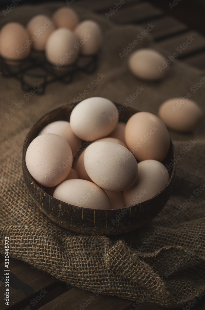 Natural, organic eggs in wooden bowl, zero waste Easter Natural, organic eggs in wooden bowl, zero waste Easter