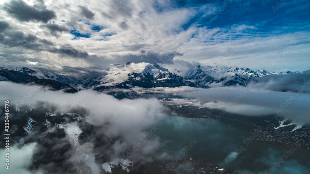 aerial shot of lake zell with alps mountains on the background, zell-am-see