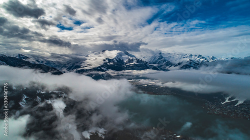 aerial shot of lake zell with alps mountains on the background  zell-am-see